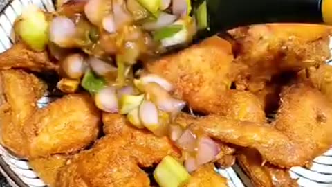 fried chicken dish with onions