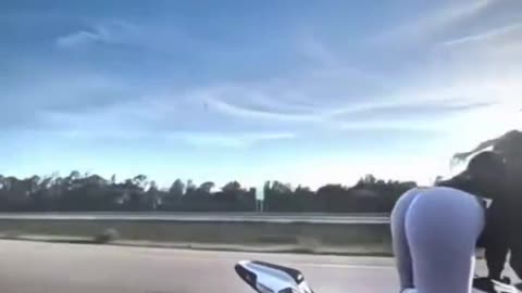 Girl Shaking Booty while driving Heavy Bike