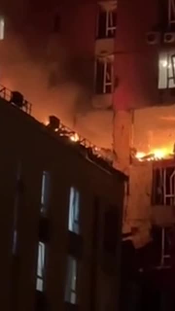 High-rise building on fire in Kyiv after being hit