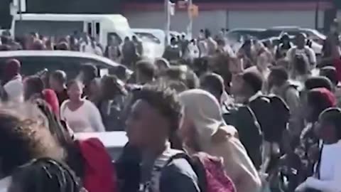 Teens in Brooklyn, NY walk through traffic, because it’s a trend on TikTok..