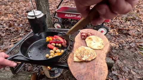 Campfire Breakfast Cooked using only a small Fire-Log in the Rain Iron Skillet Cooking