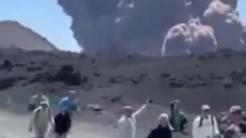 Hikers and Tourists flee as Volcano Mt. Etna erupts in Italy.