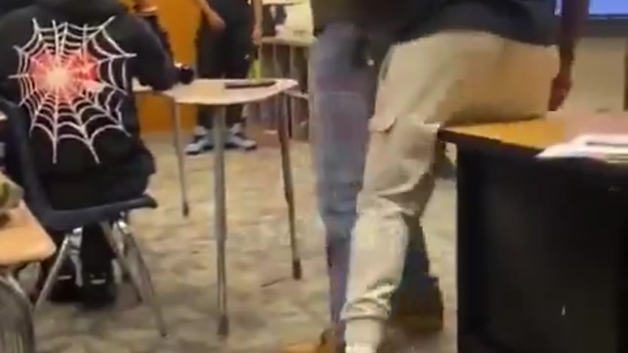 White teacher looking like he doesn't care if Blacks kill each other anymore.