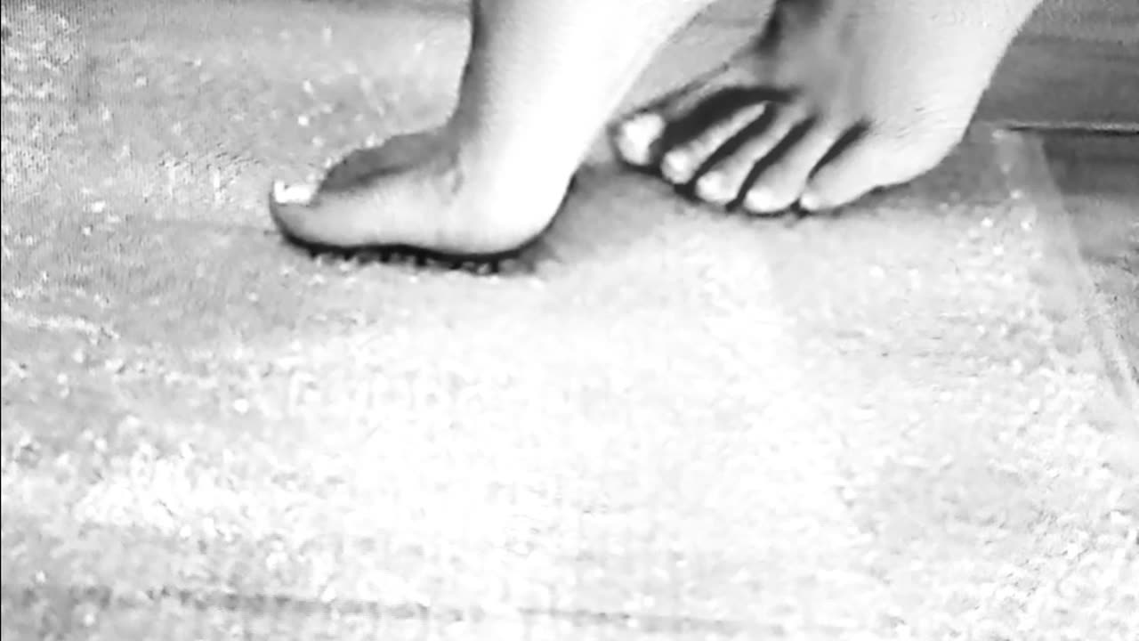 Pretty feet popping bubbles