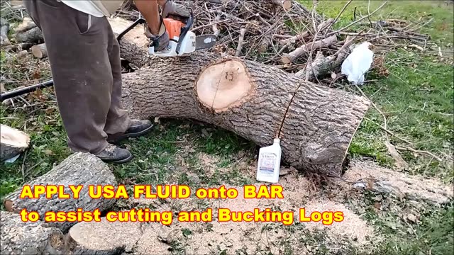 USA Fluid with Log Bucking with Chain Power Saw.