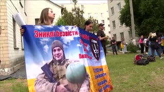 Ukrainian woman searches for husband lost in action two years ago
