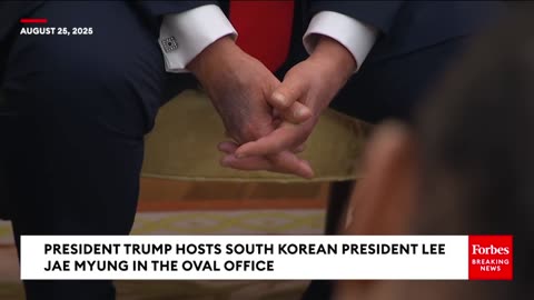 The camera zooms in on Trump's hand during his meeting with the South Korean President
