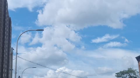 The white sun's light coming through a film of "cloudy" material in the atmosphere