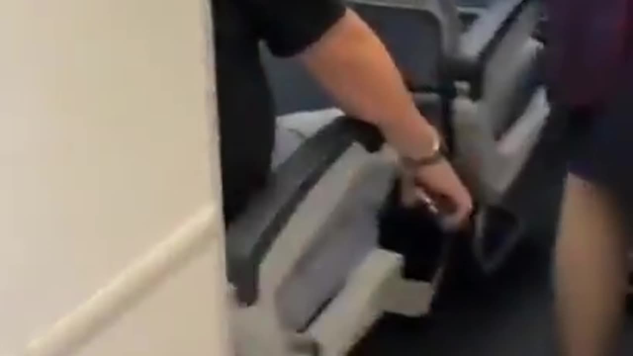 Man arrested for filming up a flight attendant's skirt. Caught in the act.