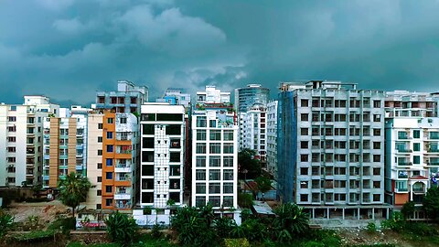 Dramatic Cloudy Sky Over Urban High-Rise Buildings in Dhaka – 4K Static Shot