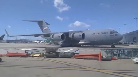 The Boeing C-17 Globemaster III using engine thrust reverse to pushback
