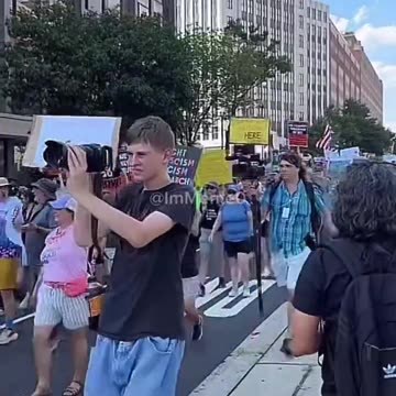 What do you notice about the protesters marching against Trump’s crackdown on crime in D.C.