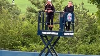 Luis Enrique watching his team train on a lift