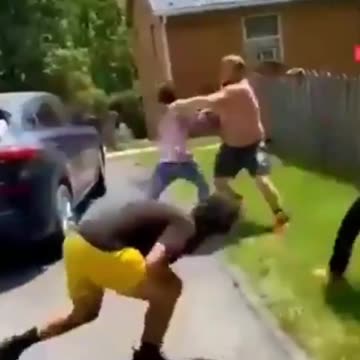 large man defends off and wins fight against 3 people at once
