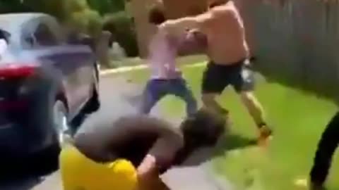 large man defends off and wins fight against 3 people at once