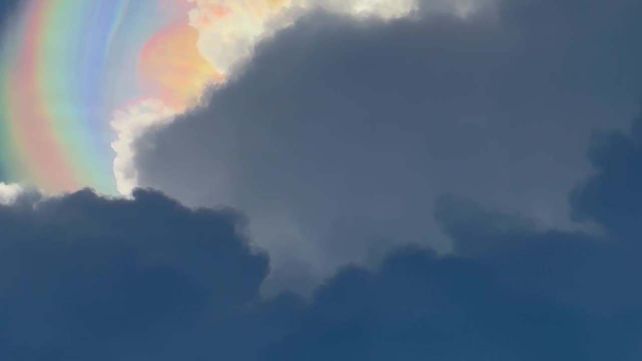 Sun Halo Peaks Through Storm Clouds