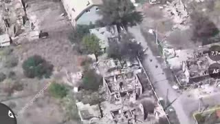 Russian Servicemen Move Through the Ruins of Pokrovsk