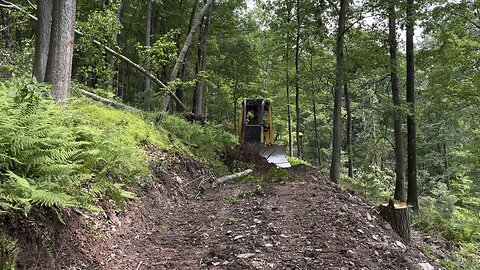Building a logging road using a JD 650G