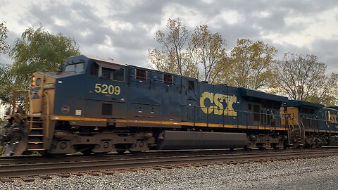 CSX Train engines 5209 and 543 head East