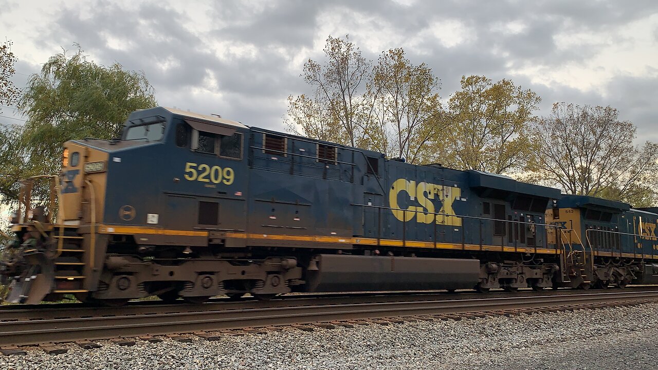 CSX Train engines 5209 and 543 head East