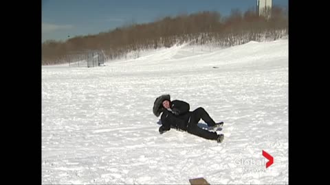 Reporter flipped by sled during news report [OFFICIAL VIDEO]