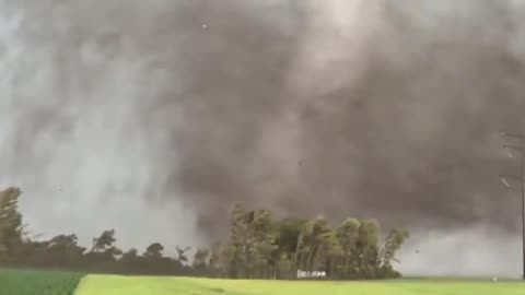 Storm chaser, Reed Timmer, films a massive tornado on the border of Minnesota & South Dakota.