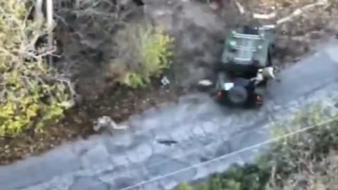 Russian Attack Drone Slams into Ukrainian Vehicle Failing to Detonate