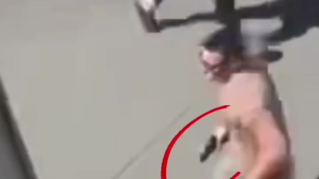 Is this man running with a hand gun??