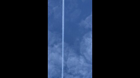 Plane with white trail Wales UK 21/11/2025