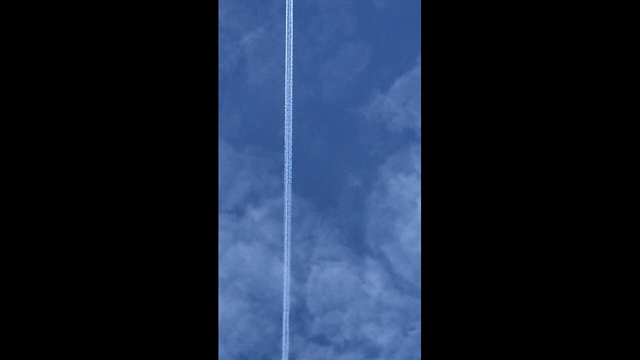 Plane with white trail Wales UK 21/11/2025