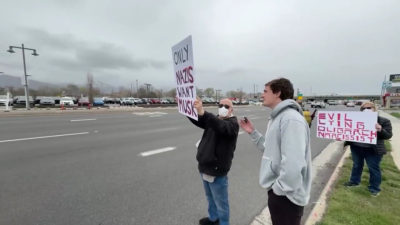 liberal protester, was seen doing multiple Nazi salutes while standing on the side of a busy road