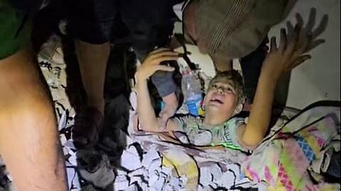 Watch now: A child was rescued from the rubble of her house that was bombed by Israel in Gaza