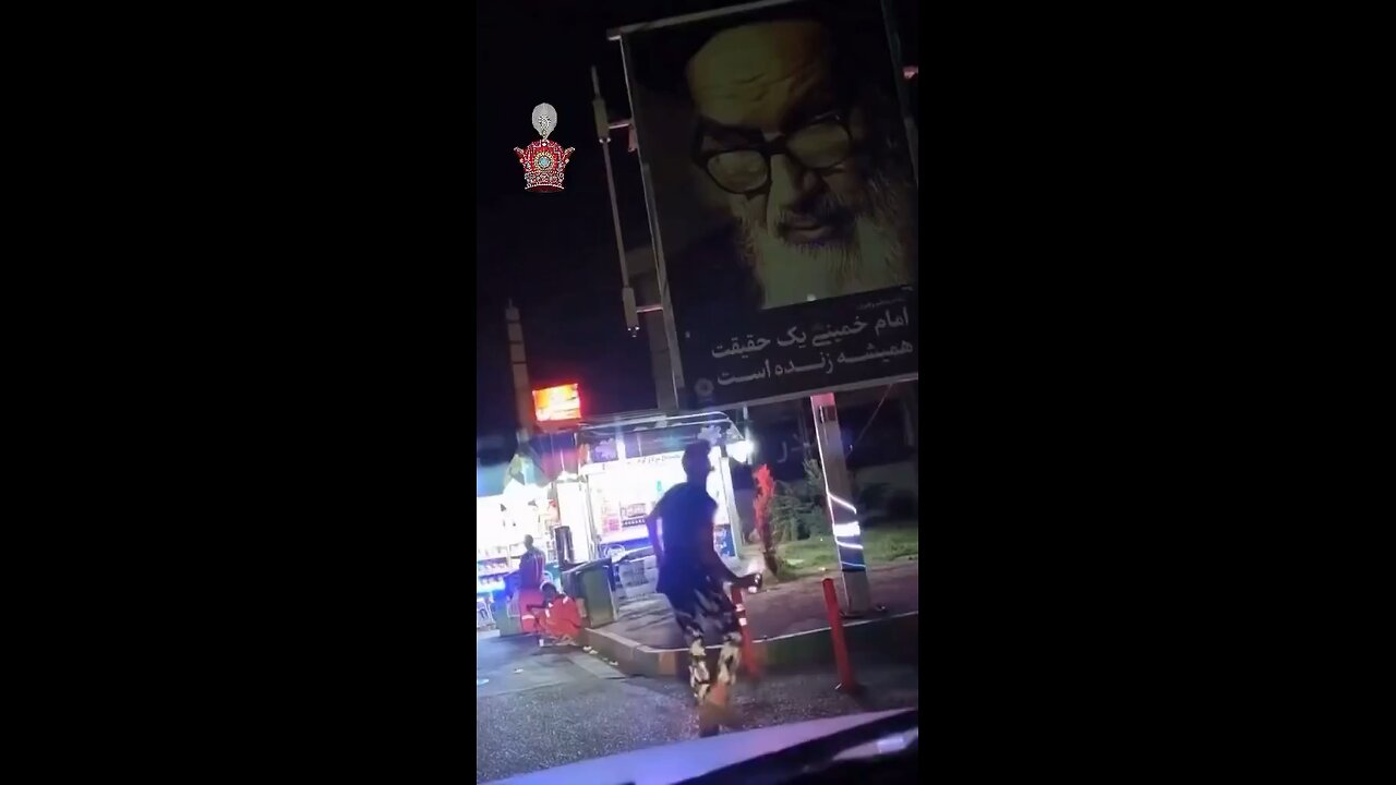 Bold Iranians burn Khamenei poster.