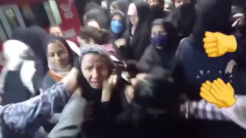 A female morality police officer beat a woman for not wearing hijab