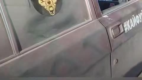 Russian Soldier Can't Stop Laughing at Comrade's Car