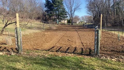 Raising the garden fence to prevent deer jumping it.