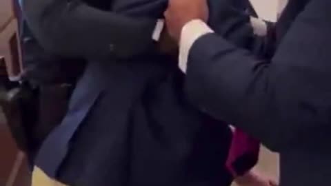 Mitch McConnell trips and falls to his knees.