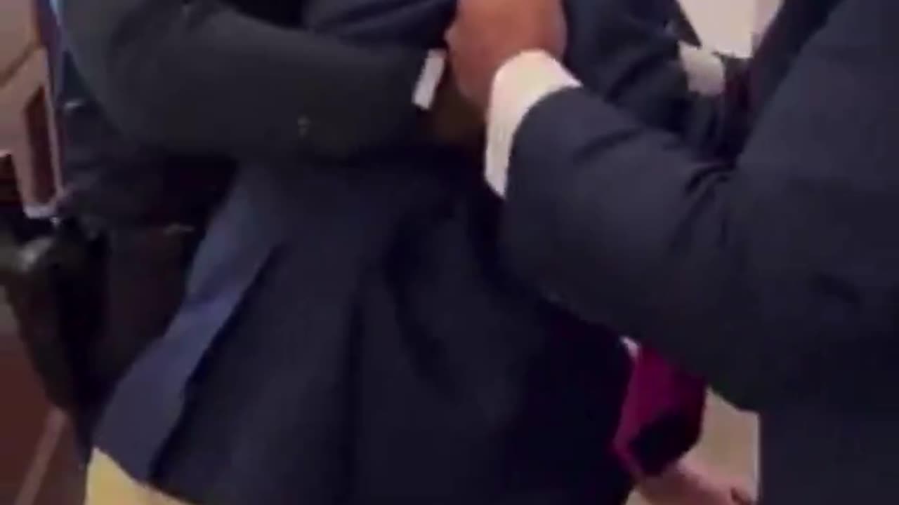 Mitch McConnell trips and falls to his knees.