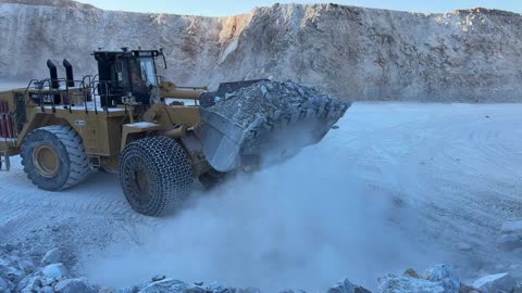Caterpillar 992K Wheel Loader Loading CAT 777F Dumpers With Blasted Rocks