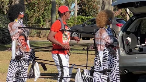 Man Has Puppet Back Up Dancers