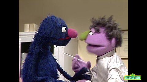 FLASHBACK: Sesame Street’s Grover gets his booster shot during his wellness check
