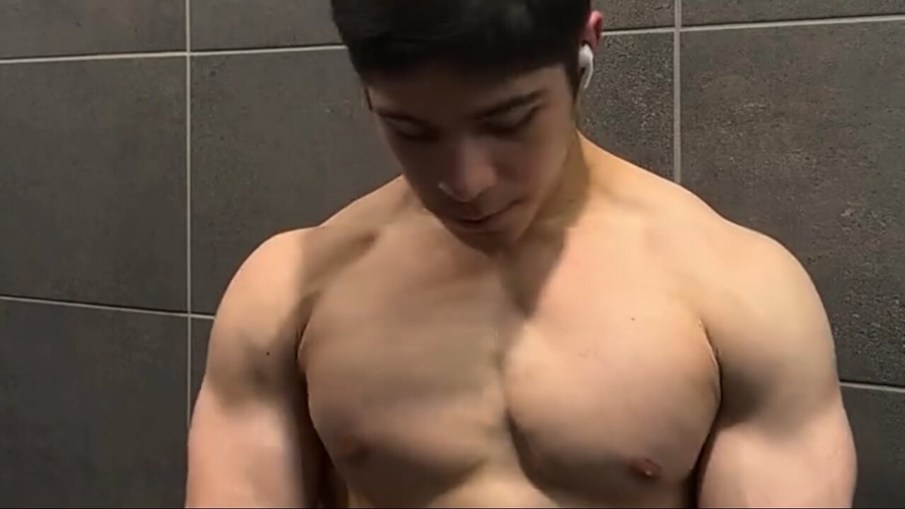 Young man flexing his muscles