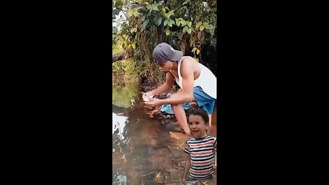 "The River Washer: When Detergent Meets Nature! 🌊🧺😂"