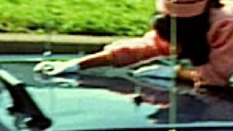She’s trying to get away from the driver. She saw him turn and shoot the president in the head