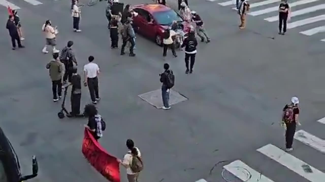 Protestor gets ran over
