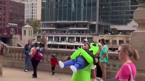Liberal terrorlst at the ‘No Kings’ protest in Chicago wears a costume of an alien