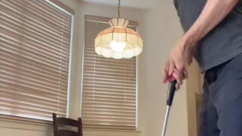 He swings golf club inside