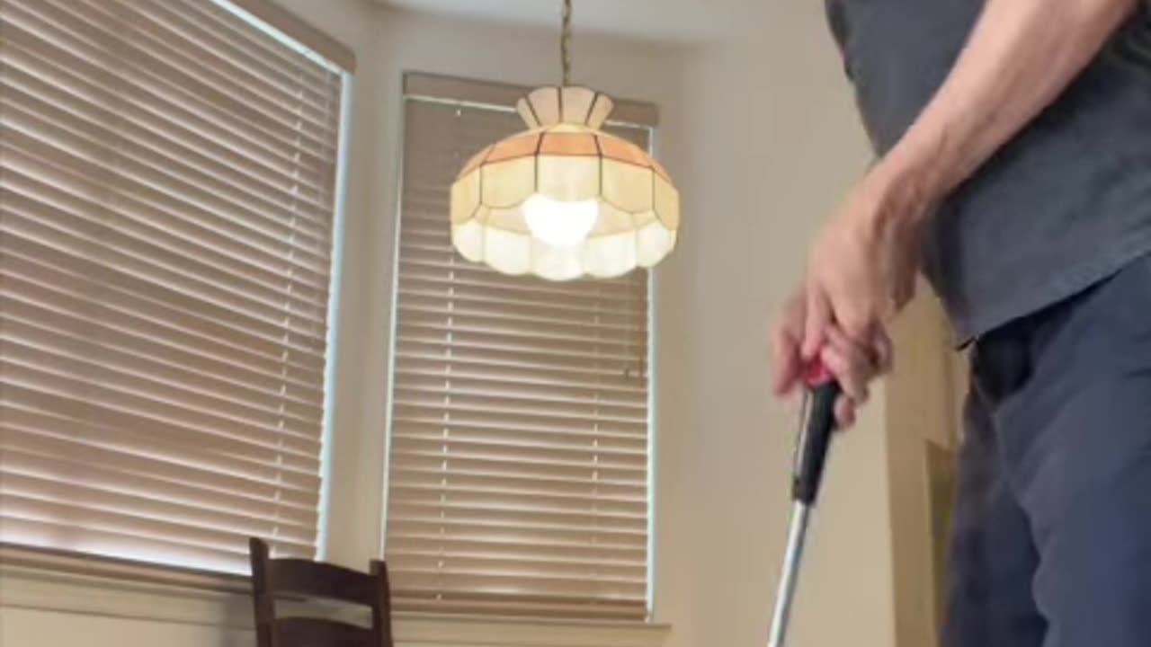 He swings golf club inside