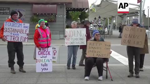 People protest Alaska energy summit, Trump delegation seeking more oil production