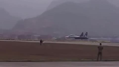 Su-30 performing low fly above runway